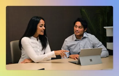 Man and women working on laptop.