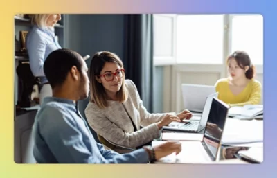 Man and women working on laptop.